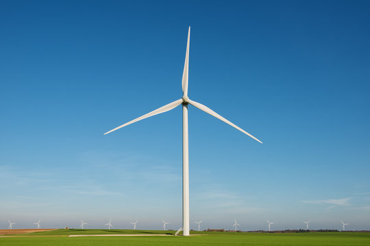wind turbine with rotation effect on blue sky backround