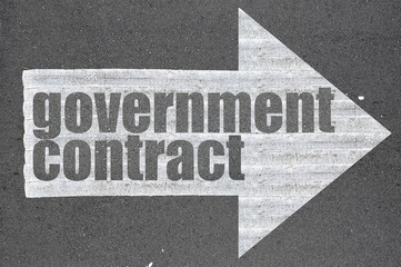 Arrow on asphalt road written word government contract - 98919976