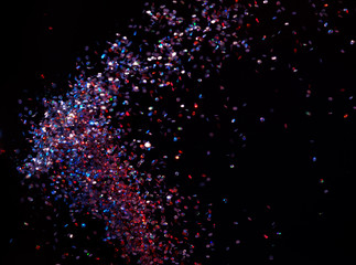 Lots of sequins over the dark background
