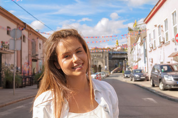 Fototapeta premium Young girl posing on the street.