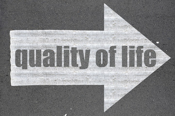 Arrow on asphalt road written word quality of life - 98922359