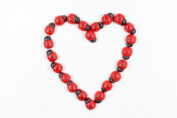 heart shape with wooden ladybug