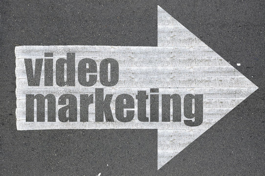 Arrow on asphalt road written word video marketing