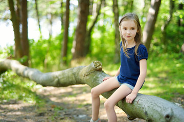 Adorable little girl hiking in the forest © MNStudio