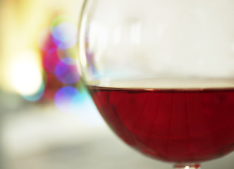 Glass of red wine on blurred background