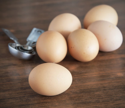 fresh brown eggs in bowl.