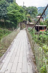 Suspension bridge over small stream in Ecuador