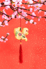 Chinese lunar new year ornaments toy of monkey on festive background