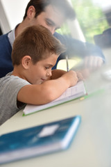 Closeup of young boy doing homework