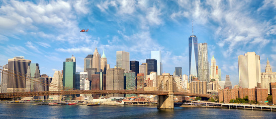 Manhattan skyline panorama with Brooklyn Bridge in New York City, United States