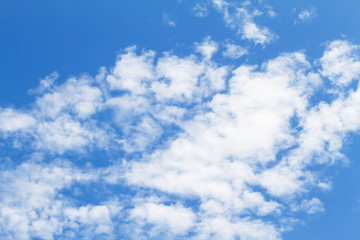 Naklejka na ściany i meble Partly cloudy blue sky background