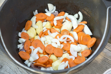 Fresh vegetables for lunch in a metal bowl