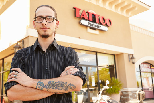 Portrait Of Tattoo Artist Standing Outside Parlor