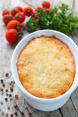 potatoes casserole on gray cracked wooden background