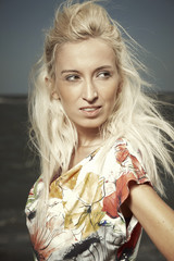 Portrait of blonde beauty on beach