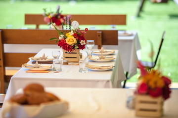 decorated table with flowers in the garden