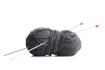 grey yarn for knitting with spokes on white background isolated