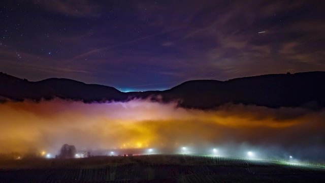 Foggy Winternight over a Town Timelapse UHD - Panning