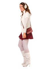 Fototapeta premium Portrait of young woman wearing in fur earphones and white swea