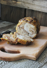 Roasted chicken roll on a cutting board