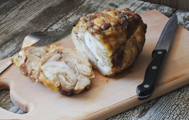 Roasted chicken roll on a cutting board