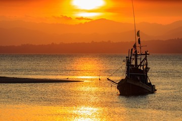 Sunset Coastal fisheries boat in Thailand