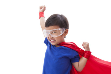 Little boy pretending to be a superhero on white background.