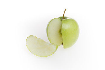 Green apple and slice isolated over white background