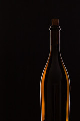 Detail of bottle with red wine