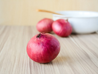 Red Onion on old wooden background