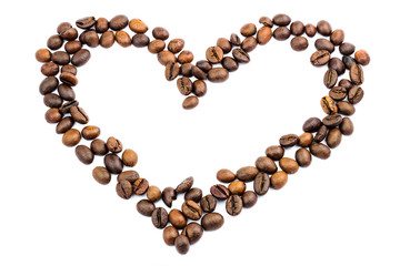 Roasted coffee beans in shape of heart, isolated on white