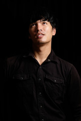 Asian man portrait in the dark