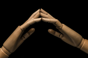 Clenched fist and appeasement on black background