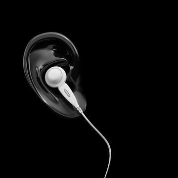 White Earbud Headphones In Ear On Black