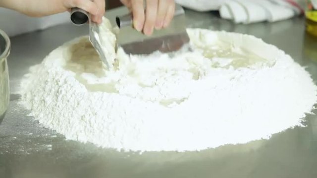 Woman preparing  pizza dought