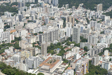 Rio de Janeiro, Brazil city skyline view from above featuring greenery interspersed with jumbles of skyscrapers