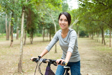 Fototapeta na wymiar Woman riding bicycle