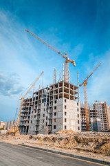 New multi-storey houses and tall cranes