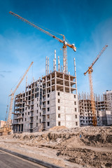 Constructionsite and construction cranes