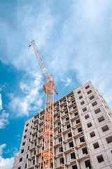 Fototapeta na wymiar Building of new apartments and crane