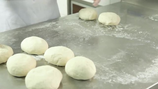 Woman preparing  pizza dought
