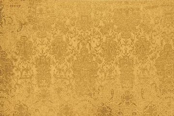 Schapenvacht deken met patroon Stof shiny gold fabric with a pattern closeup