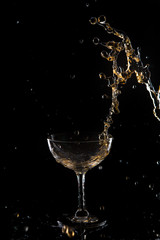 Red wine splash on black background