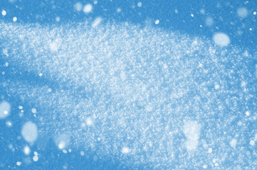 Winter background with shiny snow and blizzard