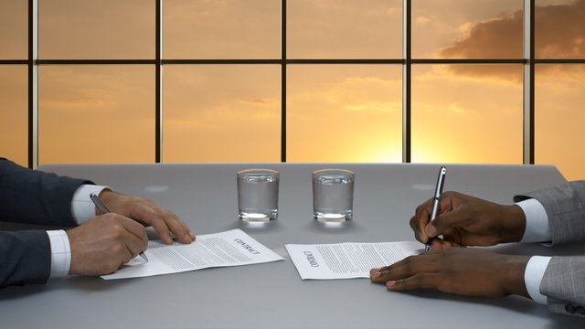 Signature of contracts in the business center.
