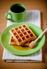 Traditional belgium soft fresh waffles with a honey. Toned