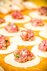 Pelmeni - Russian ravioli. Cooking process. Selective focus. Ton