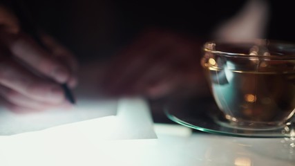 Man working at night, learning literature
