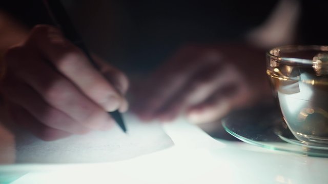 Man working at night, learning literature