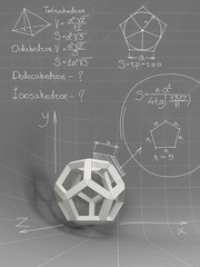 white geometric shapes and equations on the gray board